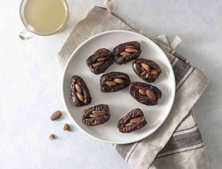 A plate of date stuffed with almonds