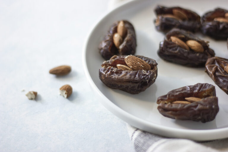 A plate of almond-stuffed dates dipped in cinnamon